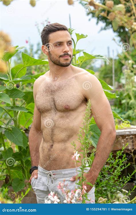 Handsome Hairy Shirtless Man Standing In Garden Stock Image Image Of