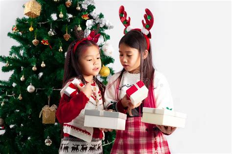 Merry Christmas Little Asian Kids Girls In Red White And Green