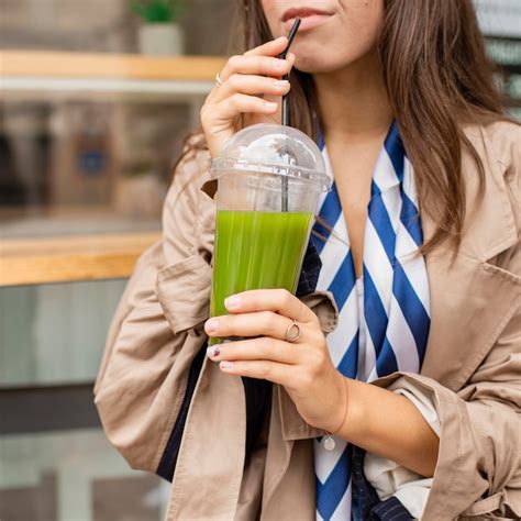 Free Photo Woman Drinking Green Smoothie