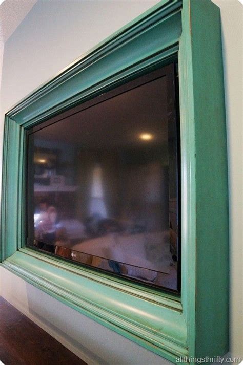 It's built like a mini version of a barn door that is just big enough to cover your television. Ana White | TV Frame Tutorial - Feature by All Things ...