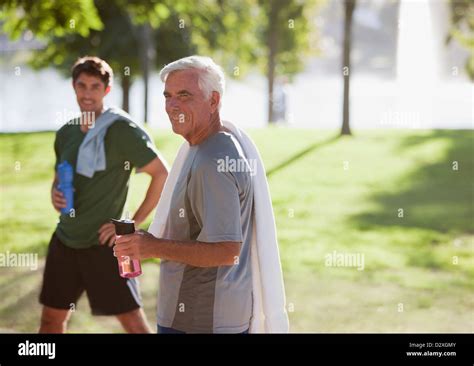 Men Drinking Water After Workout Stock Photo Alamy