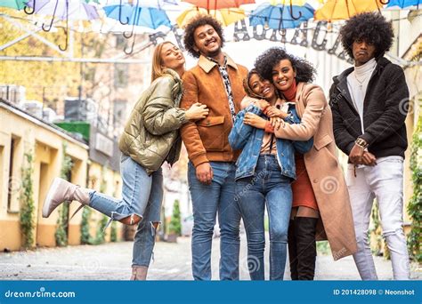 Group Of Multiracial Friends Having Fun Together Outdoor Stock Photo