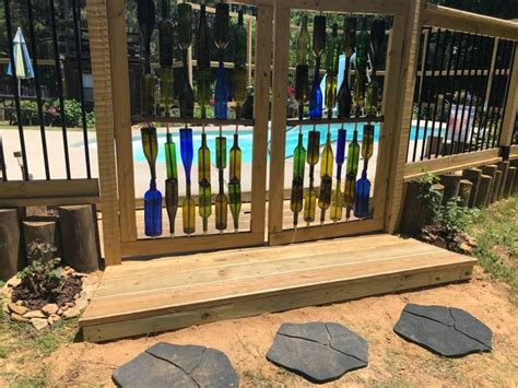 Moreover, because of an enclosure, the not only do they beautify your pool area, but they also ensure the safety of your children from any unseen accident. Pool gate from old bottles makes a safe enclosure for swimming pool | Pool gate, Old bottles ...
