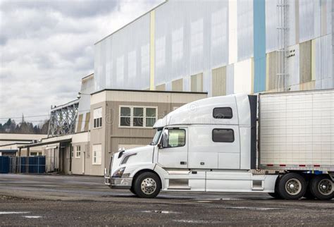 Profile Of White Modern Big Rig Semi Truck With Refrigerated Semi