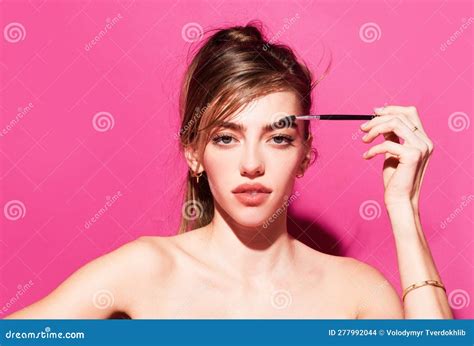 Combs Eyebrows With A Brush In A Beauty Salon Woman With Long