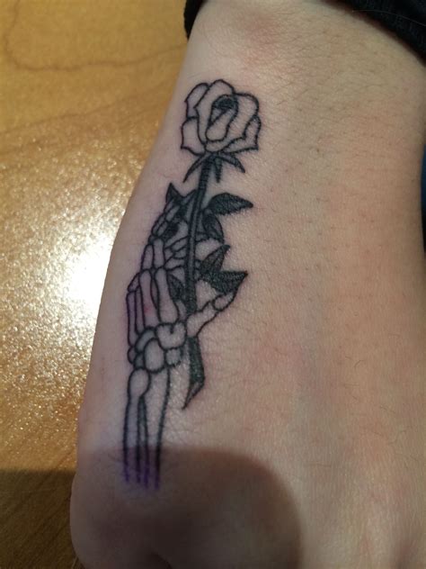 Forearm Skeleton Hand Holding Rose Tattoo Viraltattoo