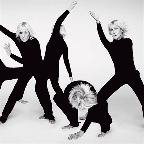 Three Women In Black And White Pose With Their Hands Up As If They Are Dancing