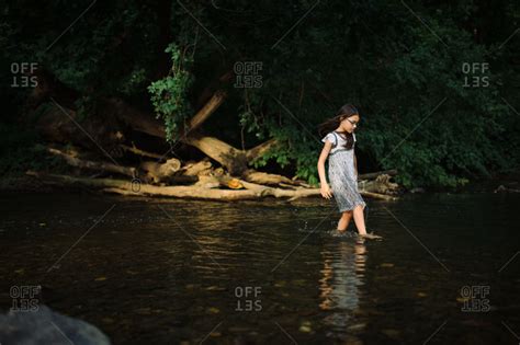 Girl In Dress Wading In River Stock Photo Offset