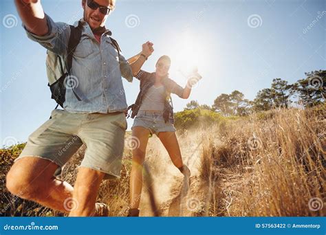 Happy Young Couple Having Fun On Their Hiking Trip Stock Photo Image