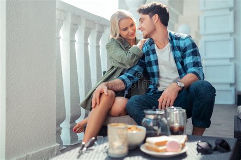 Girlfriend Hugging Man While Enjoying Breakfast Outside Stock Photo