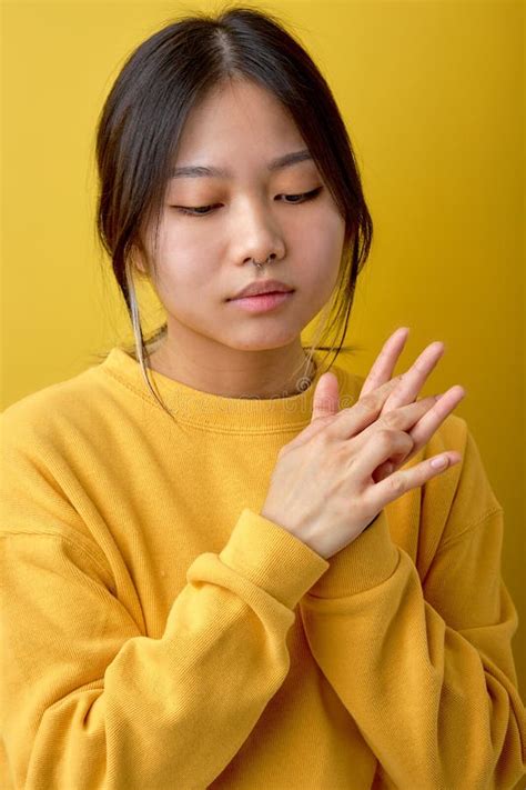 Close Up Portrait Of Chinese Brunette Female Keeping Hands Together