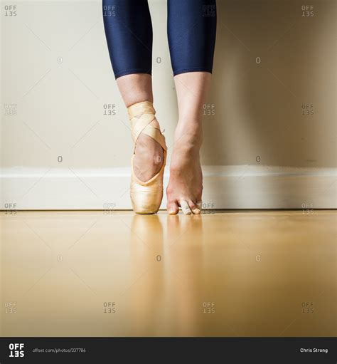 Ballerina Wearing One Pointe Shoe Standing On Tip Toes Stock Photo Offset