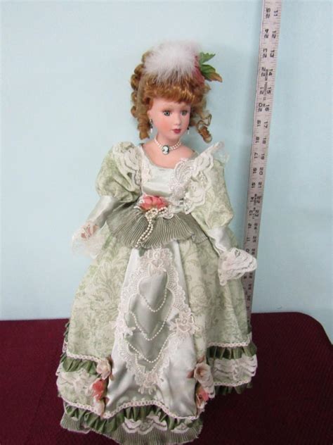 LOT SOUTHERN BELLE PORCELAIN DOLL WITH A CAMEO NECKLACE EstateSales Org
