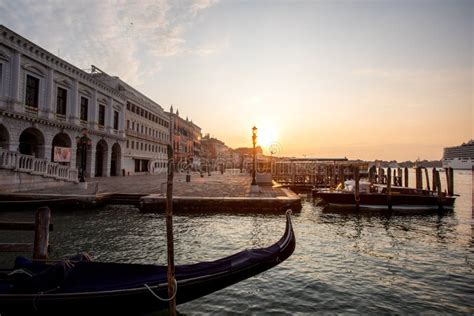Gondolas Of Venice Italy In The Morning Against The Backdrop Of Sunrise