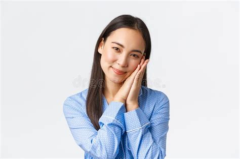 Close Up Of Tender Feminine Asian Woman In Blue Pajama Leaning Face On