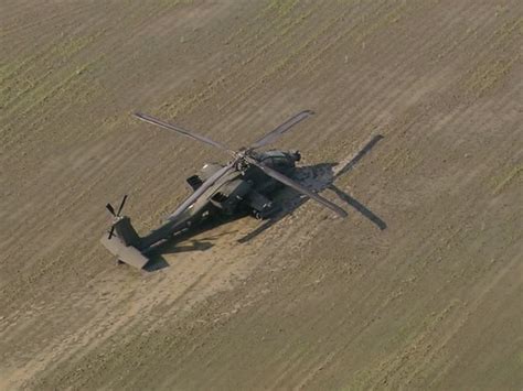 It started to pour just as the last shot fired. U.S. National Guard Apache helicopter stuck in muddy field ...
