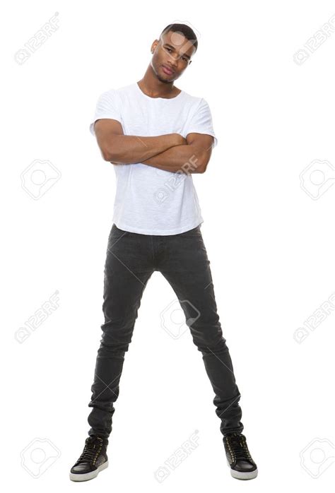 Full Length Portrait Of A Confident Young Man Posing With Arms Stock