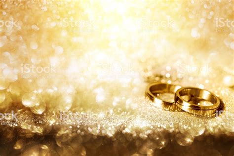 Free Download Wedding Rings On Festive Golden Background Stock Photo