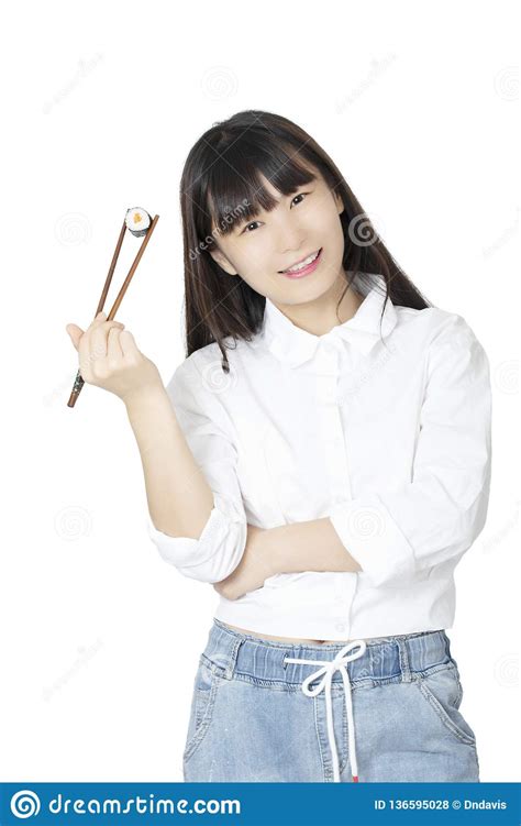 Typical chinese chopsticks will be longer and thicker than japanese or korean chopsticks and have second, let people know that the top ends of the chopsticks should be held as close together as they can hold them. Chinese Woman Holding Sushi With Chopsticks Isolated On White Background Stock Photo - Image of ...