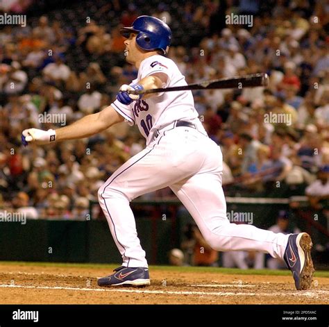 Texas Rangers Michael Young Follows Through On A Bases Loaded Double