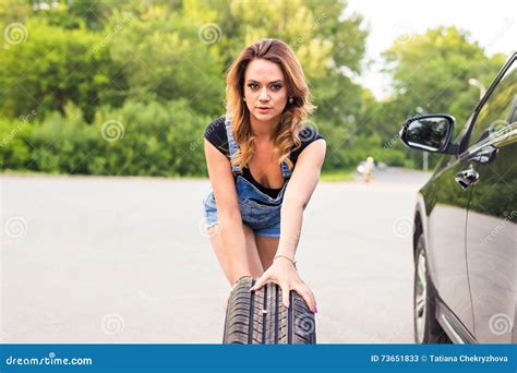 Woman Changing Wheel On A Roadside Stock Image Image Of Drive Safety
