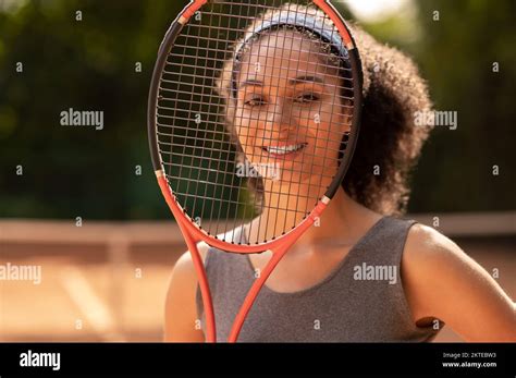 Smiling Cute Female Tennis Player With A Racket In Hands Stock Photo