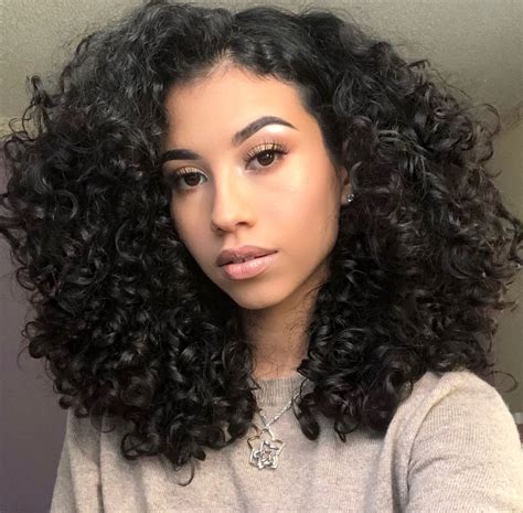 The graduated curly hairstyle is styled into waves throughout the whole head showing off the layers cut to enhance the movement and lighten the edges. Big Curly Hair | Natural Curls | 3a 3b Hair type | Simple Hair style for Curly Hair Girl… (With ...