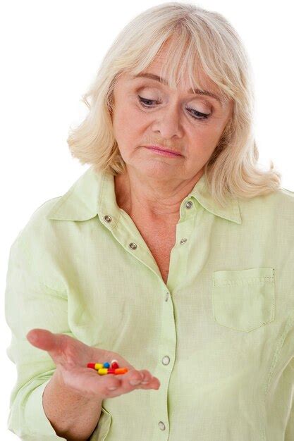 Premium Photo Taking Pills Depressed Senior Woman Holding Pills In