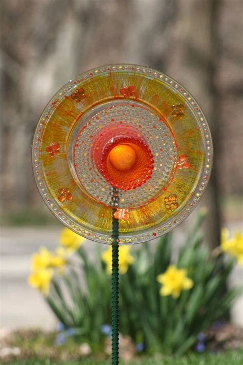 Glass plate flowers are garden art creations, made of vintage glass items. Glass Plate Garden art Yard art Sun Catcher on Etsy via ...