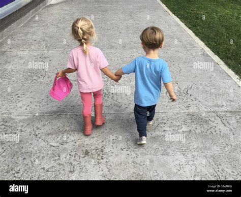 Kids Walking Holding Hands Stock Photo Alamy