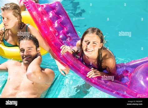 Happy Friends Enjoying In The Swimming Pool Stock Photo Alamy
