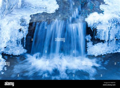 Frozen Waterfall With Blue Ice In Winter Stock Photo Alamy