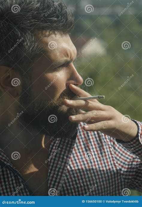 Man Smoking Cigarette Young Bearded Hipster With Beard And Moustache On Serious Face Smoking