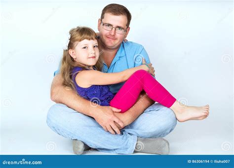 Dad Hugs His Daughter To Stock Photo Image Of Childhood 86306194