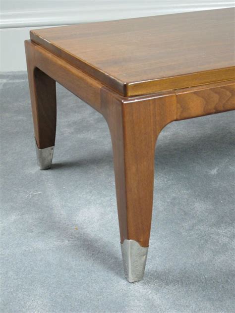Rated 4.5 out of 5 stars. Long, Low Saber Leg Coffee Table For Sale at 1stdibs