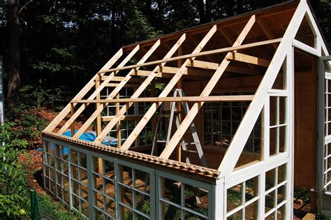 Custom Backyard Greenhouse With Recycled Windows