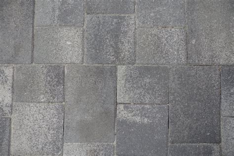 Pavement Made Of Rectangular Grey Concrete Blocks From Above Stock