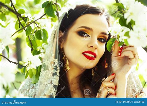 Young Pretty Indian Girl In Jewelry And Veil Posing Cheerful Happy