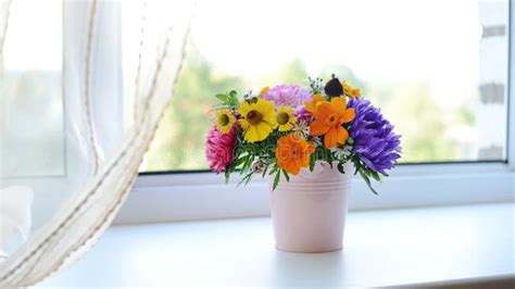 Bouquet Of Flowers On The Windowsill Stock Photo Image Of Curtain