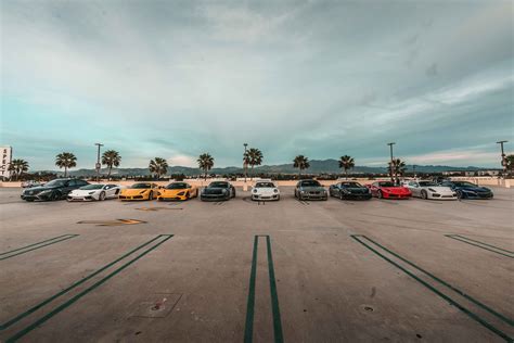 Luxury Cars Parked On Parking Area · Free Stock Photo