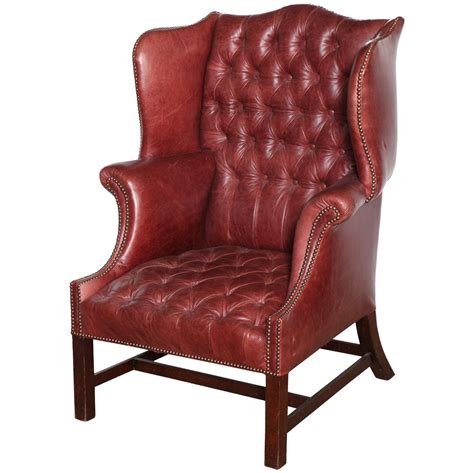 19th Century English Mahogany And Tufted Leather Wing Chair For Sale