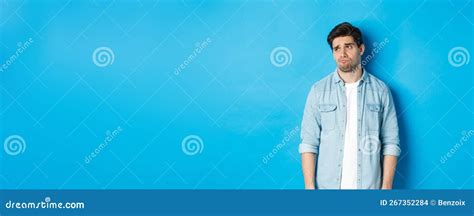 Image Of Reluctant And Sad Guy In Casual Outfit Looking Left Frowning