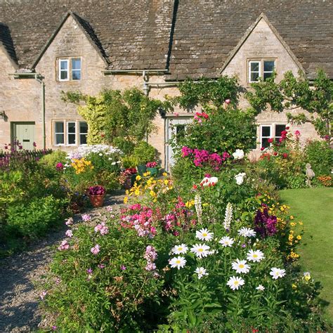 Picturesque Cotswolds Idyllic Cottage Gardens In Bibury Photograph By