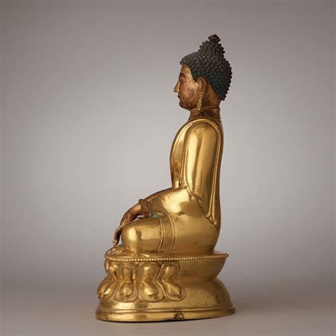 A Finely Cast Tibeto Chinese Gilt Bronze Figure Of Shakyamuni Buddha