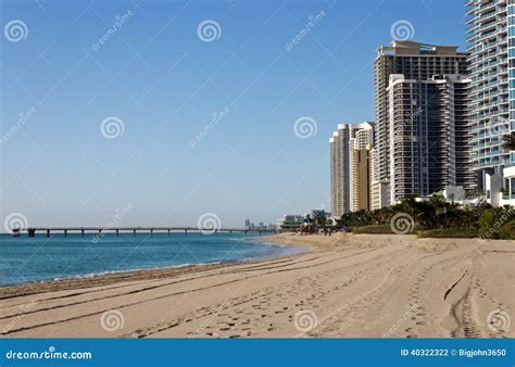 Skyline And Pier Along The Beach Of Sunny Isles Beach Florida Stock