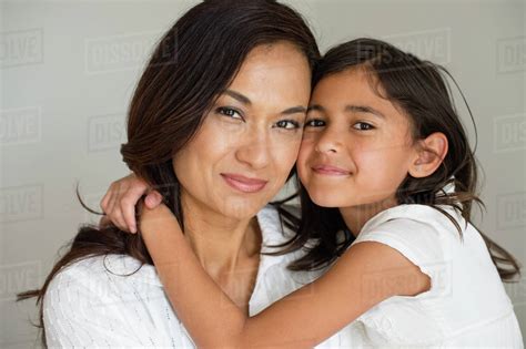 Close Up Of Mother And Daughter Hugging Stock Photo Dissolve