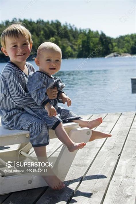 Brother And Sister On A Jetty Stockholm Archipelago Sweden Superstock