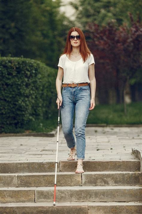 Free Photo Young Blind Person With Long Cane Walking In A City