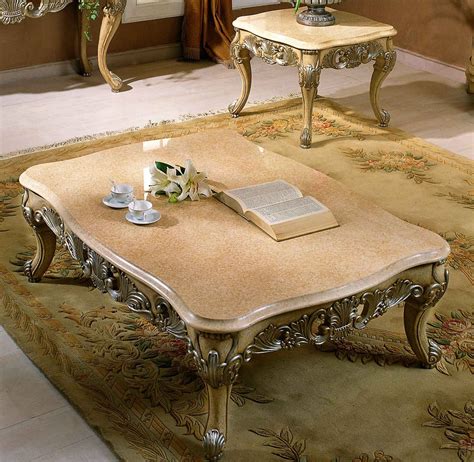 This gathering table features a solid wood tabletop and solid wood base with an antique silver finish to create a faux metal design. Sullivan End / Coffee Table w/ Marble Top - Coffee Table ...