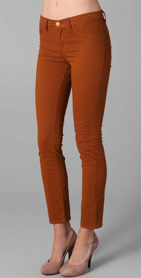J Brand Mid Rise Luxe Twill Skinny Jeans In Red Terra Cotta Lyst